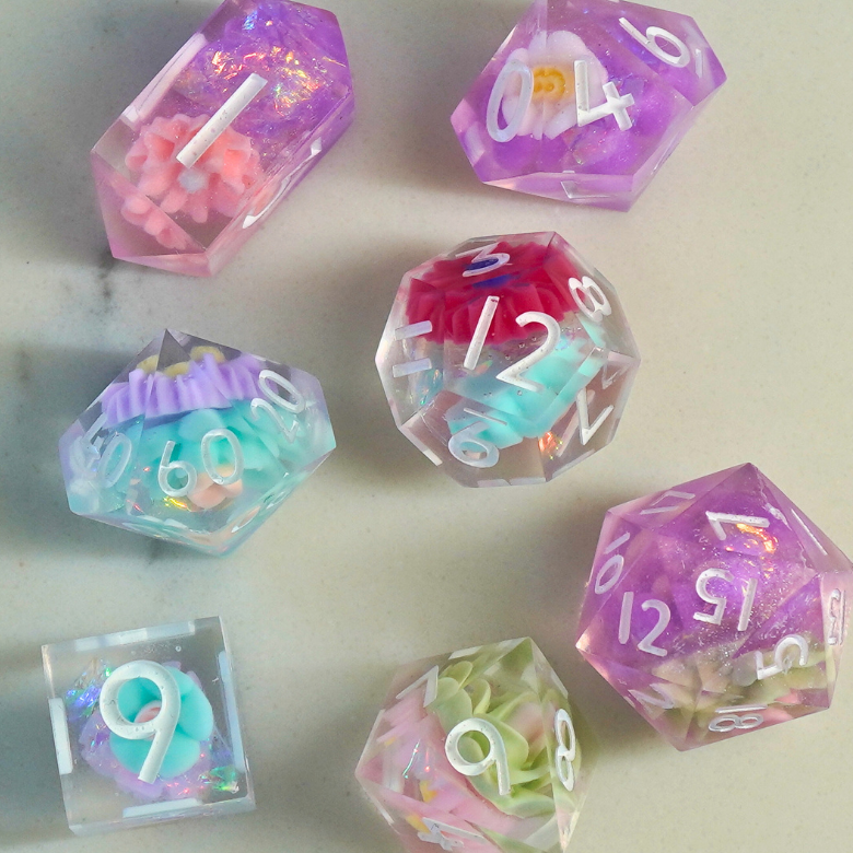 Set of colorful polyhedral dice on a light surface