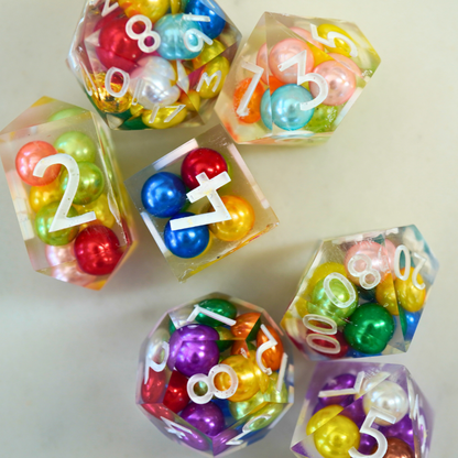 Colorful dice with numbers and letters on a light background