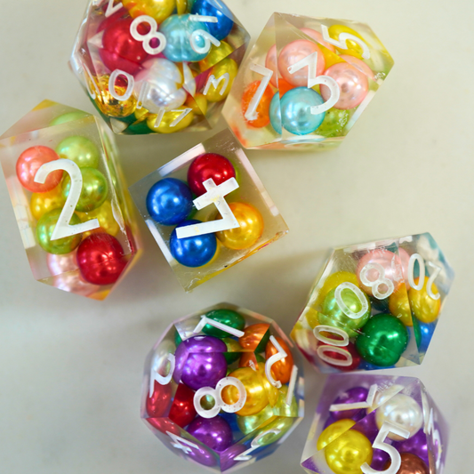 Colorful dice with numbers and letters on a light background